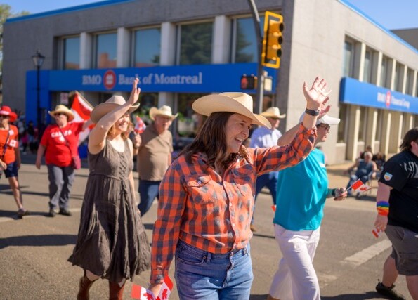 Janet Eremenko waves along the parade route