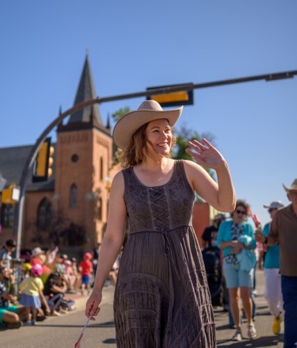 Kathleen Ganley waves along the parade route